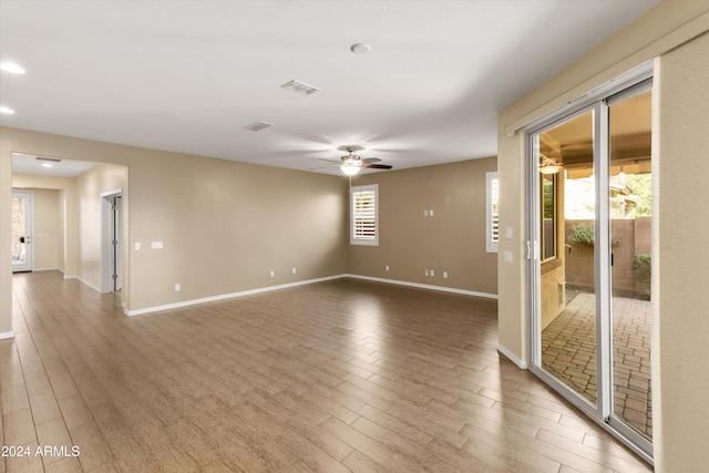 unfurnished room featuring hardwood / wood-style floors and ceiling fan