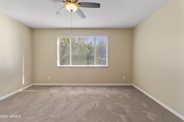 carpeted empty room with ceiling fan