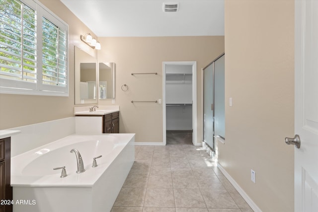 bathroom featuring vanity, separate shower and tub, and tile patterned floors