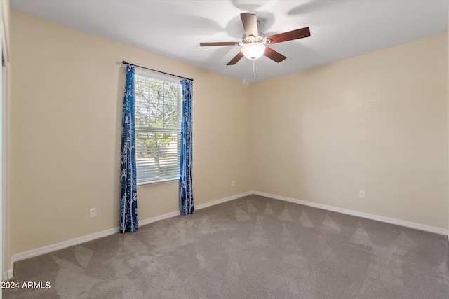 carpeted empty room with ceiling fan