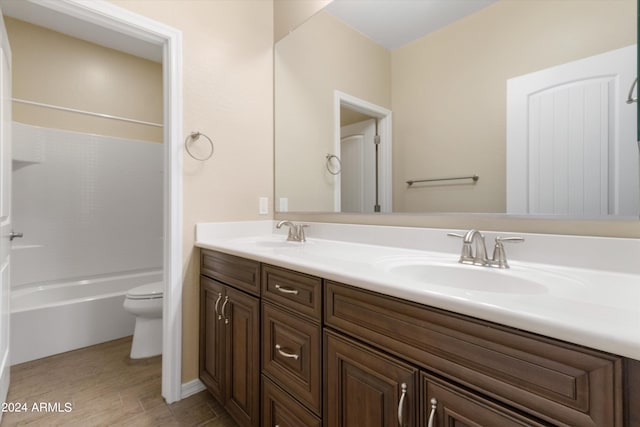 full bathroom featuring toilet, shower / tub combination, and vanity