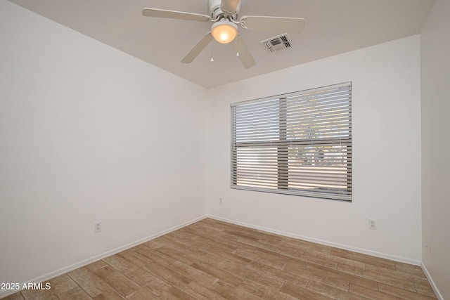 unfurnished room with light hardwood / wood-style flooring and ceiling fan