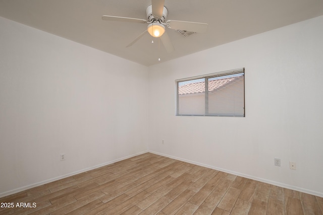 spare room with ceiling fan and light hardwood / wood-style floors