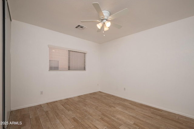 unfurnished room featuring ceiling fan and light wood-type flooring