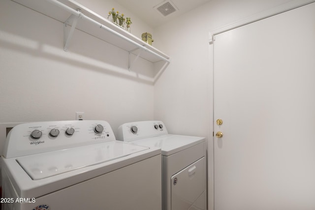 laundry room featuring separate washer and dryer