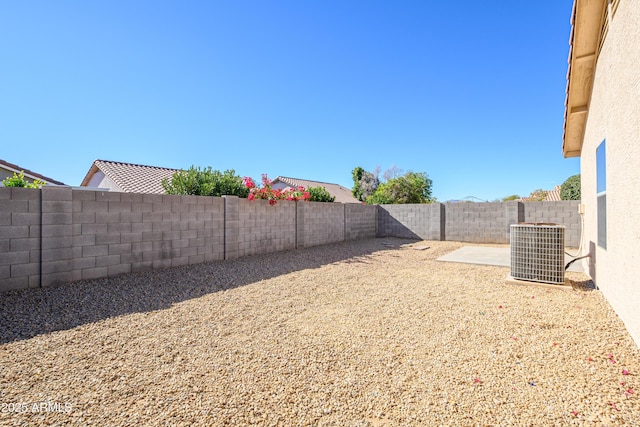 view of yard featuring a patio and cooling unit