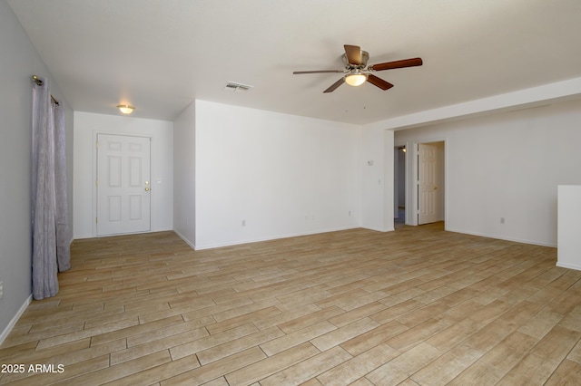 spare room with ceiling fan and light hardwood / wood-style flooring