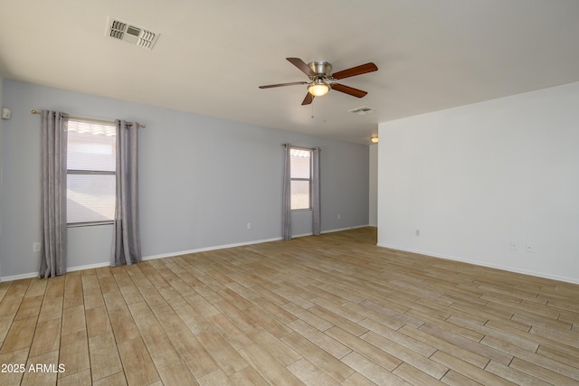 unfurnished room featuring light hardwood / wood-style floors and ceiling fan