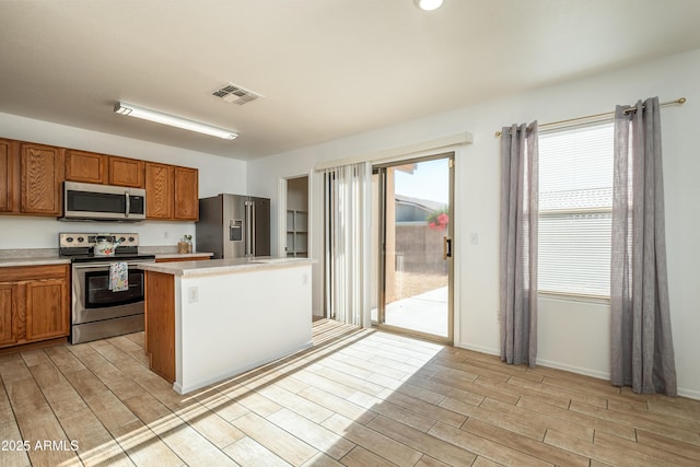 kitchen featuring a kitchen island and appliances with stainless steel finishes