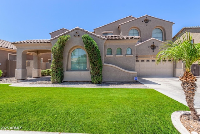 mediterranean / spanish house featuring driveway, a front lawn, and stucco siding