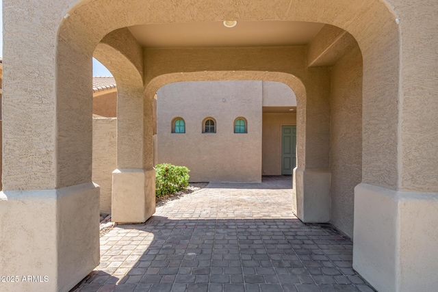 exterior space featuring a patio and stucco siding