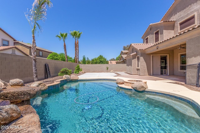 view of pool with a fenced backyard, a ceiling fan, a fenced in pool, a patio area, and a hot tub