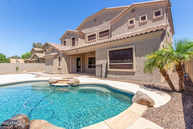 view of pool with a fenced in pool, a hot tub, a ceiling fan, a patio area, and a fenced backyard