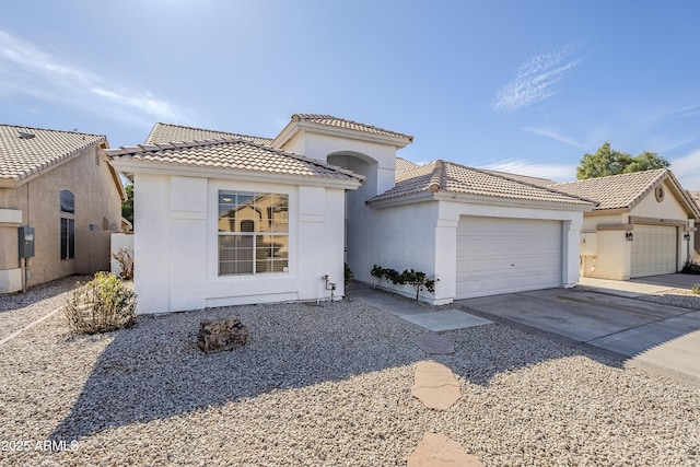 mediterranean / spanish house featuring a garage