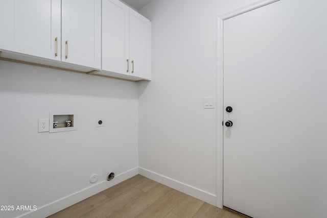 clothes washing area featuring gas dryer hookup, light hardwood / wood-style flooring, cabinets, washer hookup, and hookup for an electric dryer