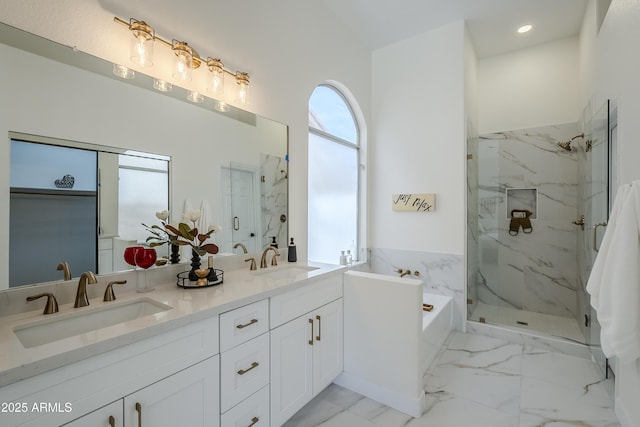 bathroom with vanity and separate shower and tub