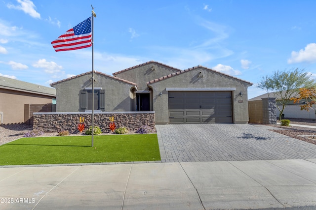 view of front of house with a garage and a front lawn