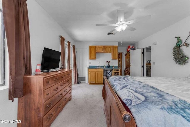 bedroom featuring light carpet and ceiling fan