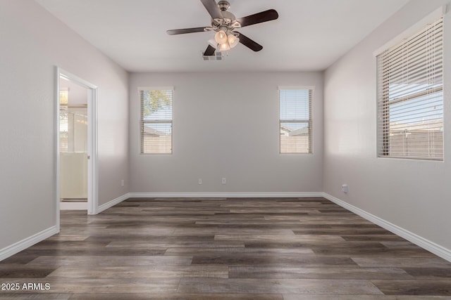 unfurnished room featuring ceiling fan and dark hardwood / wood-style floors