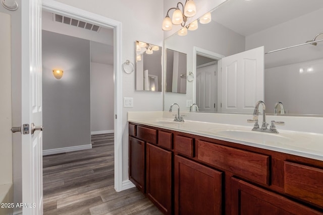 bathroom featuring vanity and wood-type flooring