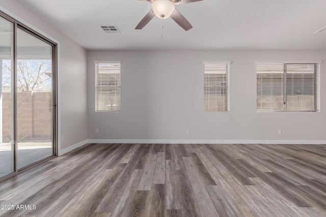 spare room featuring hardwood / wood-style flooring and ceiling fan