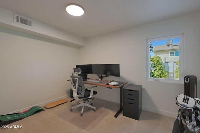 home office featuring light carpet, baseboards, and visible vents