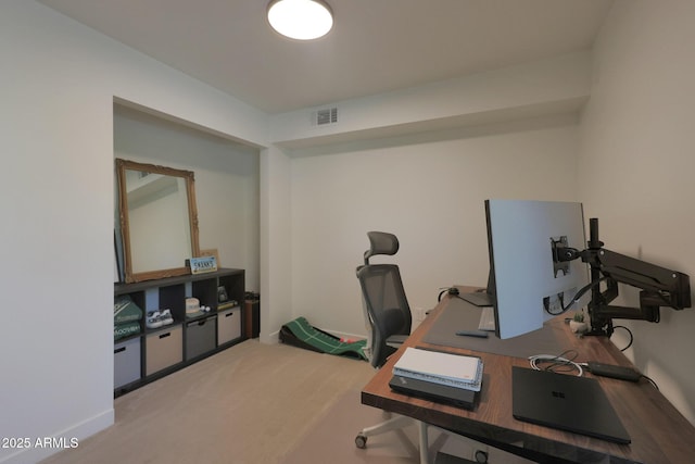 home office with carpet floors and visible vents