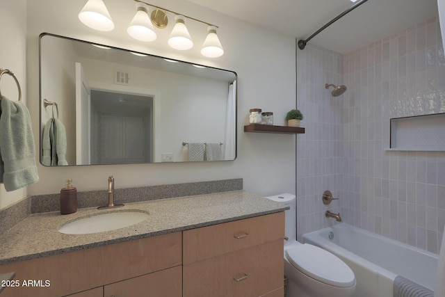 bathroom featuring visible vents, shower / washtub combination, vanity, and radiator