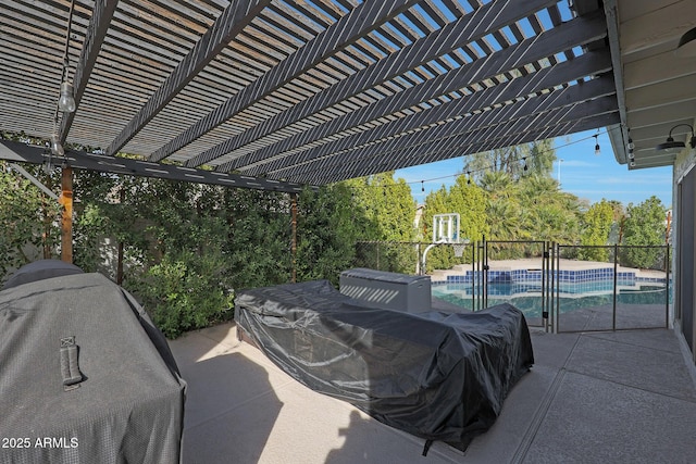 view of patio featuring area for grilling, an outdoor pool, and a pergola