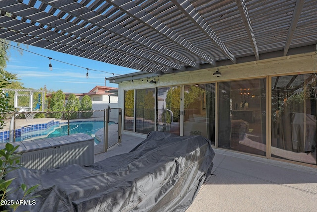 view of patio featuring a fenced in pool and a pergola