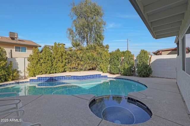 view of pool featuring a pool with connected hot tub, fence, and cooling unit