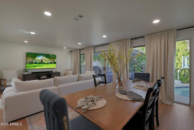 dining space featuring recessed lighting, visible vents, and light wood finished floors