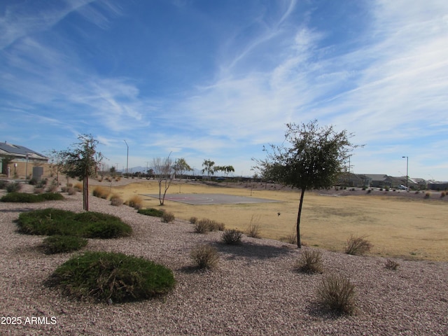 view of yard with basketball court