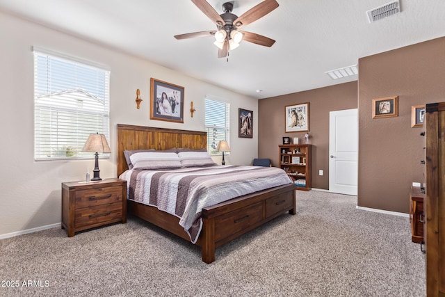 bedroom featuring ceiling fan and light colored carpet