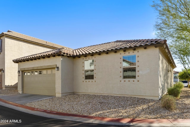 view of side of property featuring a garage