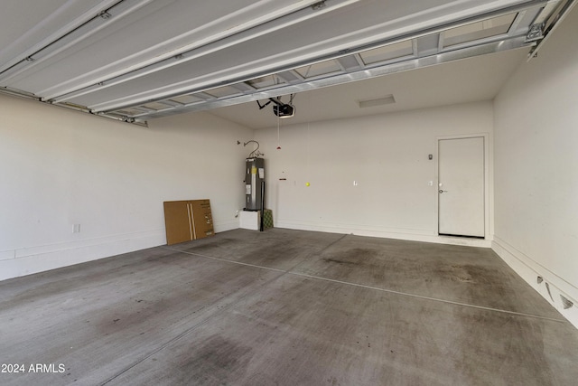 garage featuring a garage door opener and water heater