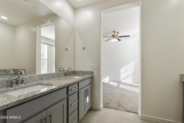 bathroom featuring tile patterned flooring, ceiling fan, and vanity