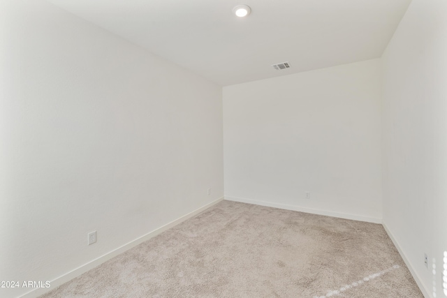 empty room featuring light carpet