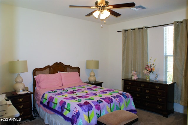 carpeted bedroom featuring ceiling fan