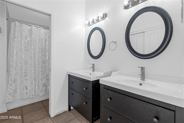 full bathroom featuring a sink, two vanities, tile patterned flooring, and shower / bathtub combination with curtain