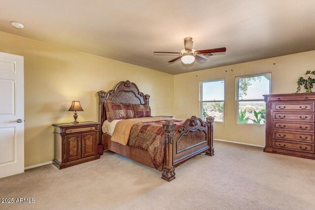 28648 N 165th Ave, Surprise, AZ 85387 - bedroom with light carpet, baseboards, and a ceiling fan