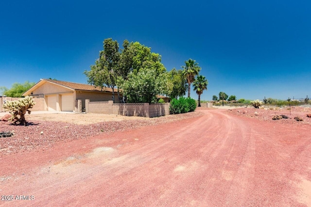 28648 N 165th Ave, Surprise, AZ 85387 - view of front of property featuring fence, an attached garage, and stucco siding