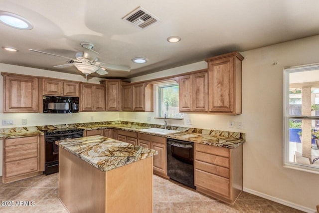 28648 N 165th Ave, Surprise, AZ 85387 - kitchen with black appliances, light stone countertops, a sink, recessed lighting, and a ceiling fan