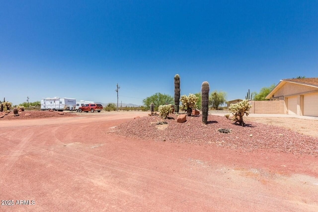 28648 N 165th Ave, Surprise, AZ 85387 - view of yard featuring a garage and fence