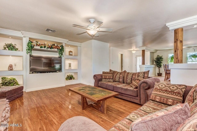 28648 N 165th Ave, Surprise, AZ 85387 - living area with a ceiling fan, wood finished floors, baseboards, and decorative columns