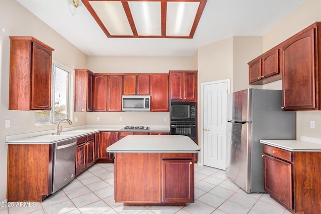 kitchen with a center island, light tile patterned floors, sink, and black appliances