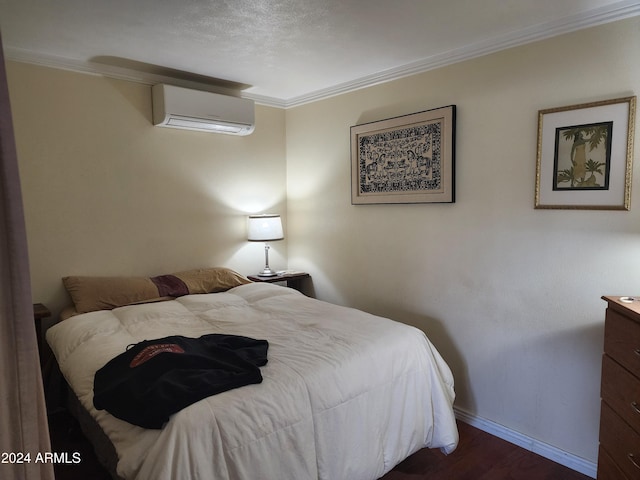 bedroom with dark wood-type flooring, an AC wall unit, and ornamental molding