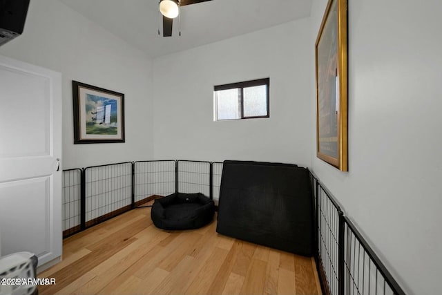 living area featuring ceiling fan and light hardwood / wood-style flooring