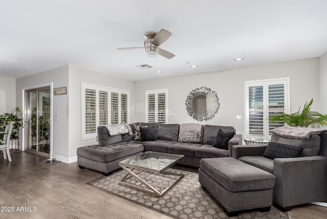 living room featuring visible vents, a ceiling fan, wood finished floors, recessed lighting, and baseboards