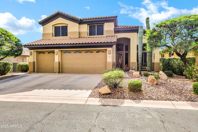 2758 N Sterling, Mesa, AZ 85207 - mediterranean / spanish-style house with stucco siding, concrete driveway, a tile roof, and an attached garage